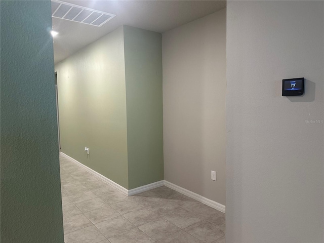 spare room featuring visible vents and baseboards