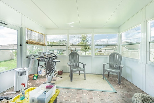 sunroom featuring a wealth of natural light