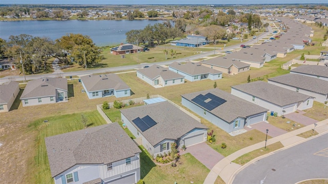 bird's eye view with a residential view and a water view