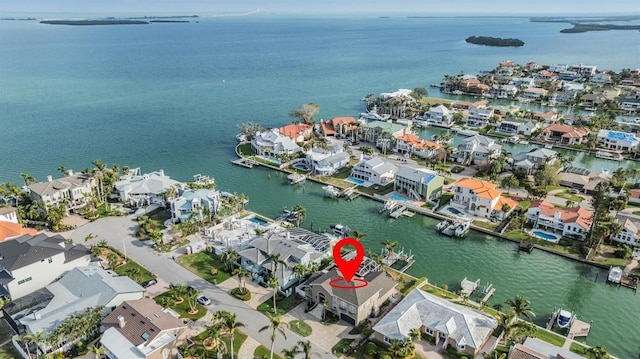 aerial view featuring a water view and a residential view