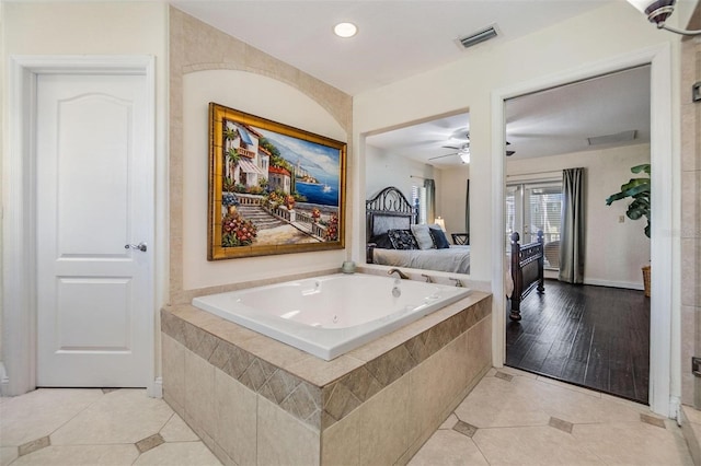 bathroom with a garden tub, ceiling fan, connected bathroom, and tile patterned floors