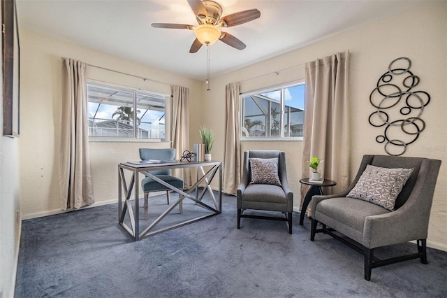 office with carpet floors, a ceiling fan, and baseboards