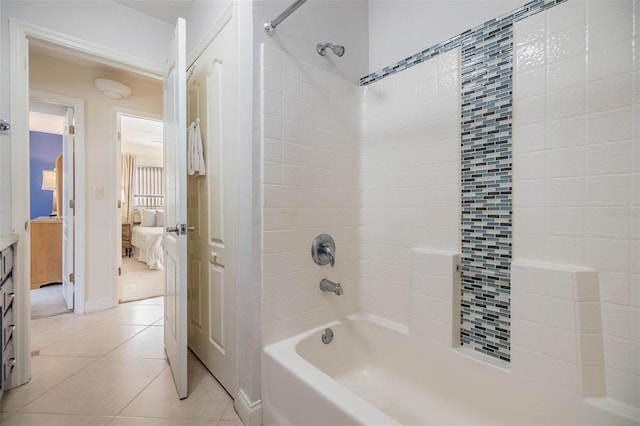 ensuite bathroom with  shower combination, tile patterned flooring, vanity, and ensuite bathroom