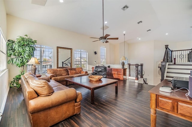 living room with recessed lighting, visible vents, and dark wood finished floors