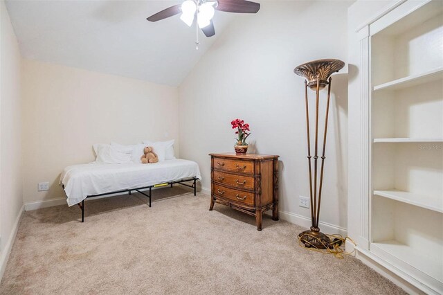 bedroom featuring a ceiling fan, lofted ceiling, carpet flooring, and baseboards