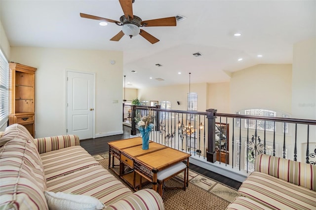 living room with lofted ceiling, wood finished floors, visible vents, and recessed lighting