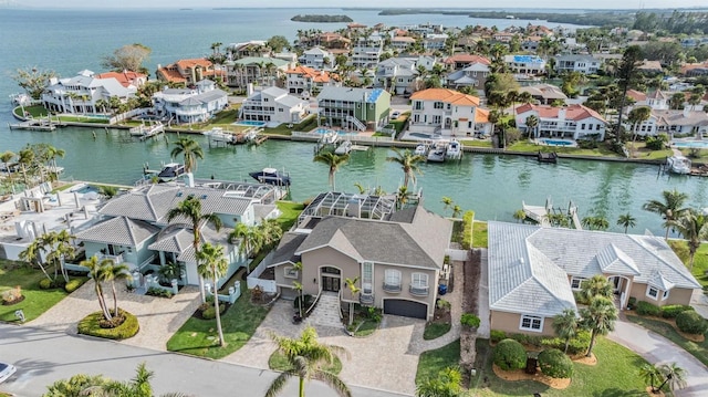 birds eye view of property featuring a residential view and a water view