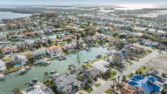 birds eye view of property with a water view and a residential view