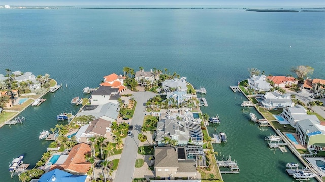 drone / aerial view with a water view and a residential view