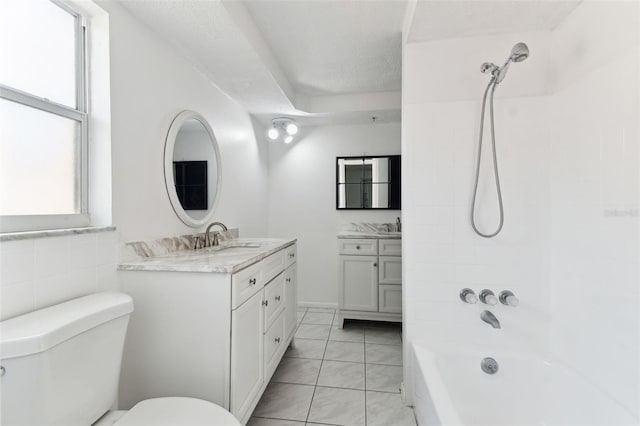 full bath with a textured ceiling, tile patterned flooring, toilet, vanity, and  shower combination