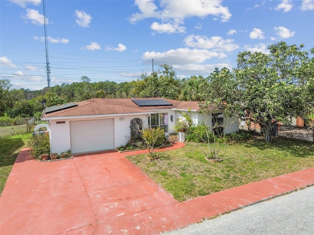 ranch-style home with concrete driveway, an attached garage, fence, a front yard, and stucco siding