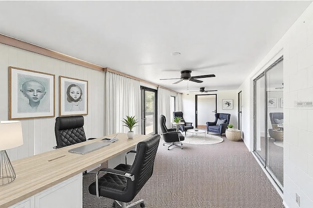 office with ceiling fan and carpet flooring