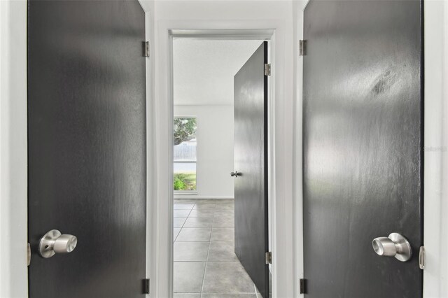 corridor featuring tile patterned floors