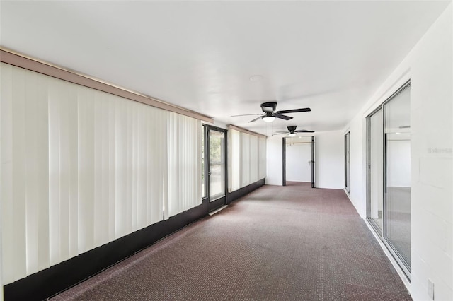 unfurnished room with carpet floors and ceiling fan