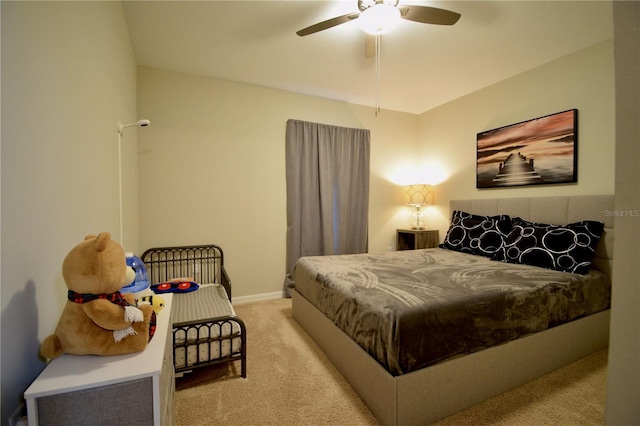 carpeted bedroom featuring ceiling fan and baseboards