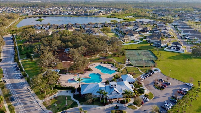 birds eye view of property with a residential view and a water view