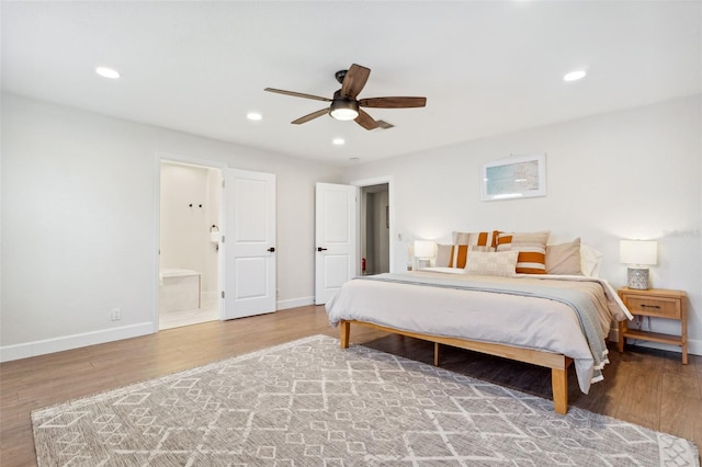 bedroom featuring recessed lighting, baseboards, and wood finished floors