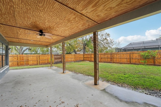 view of patio with a fenced backyard and a ceiling fan