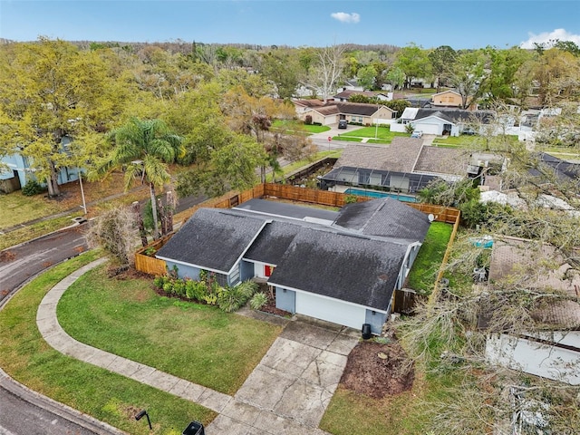 birds eye view of property with a residential view