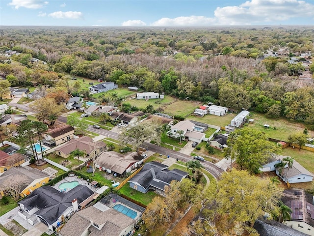 bird's eye view featuring a view of trees and a residential view