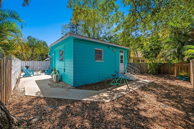 view of outdoor structure with a fenced backyard