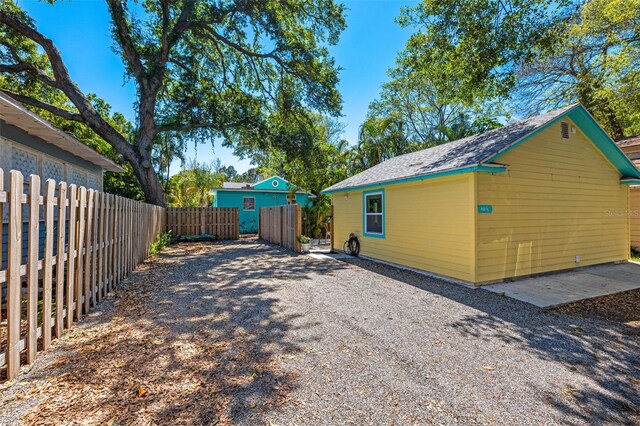 view of home's exterior featuring fence