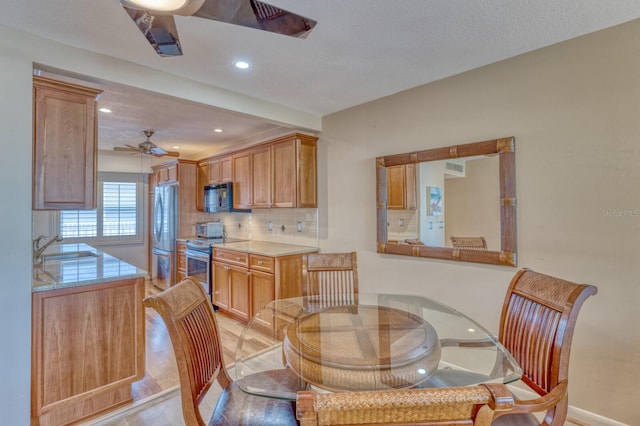 dining room featuring a ceiling fan and recessed lighting