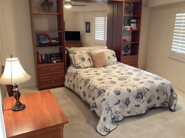 bedroom featuring light carpet