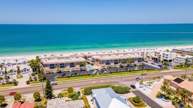 birds eye view of property with a beach view and a water view