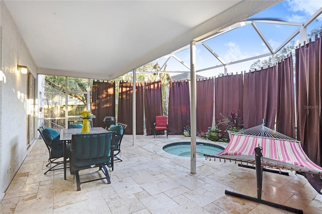 view of patio / terrace with glass enclosure, a hot tub, fence, and outdoor dining space