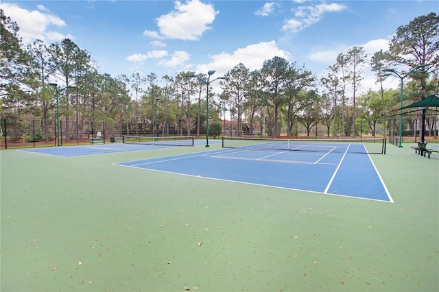 view of sport court with fence