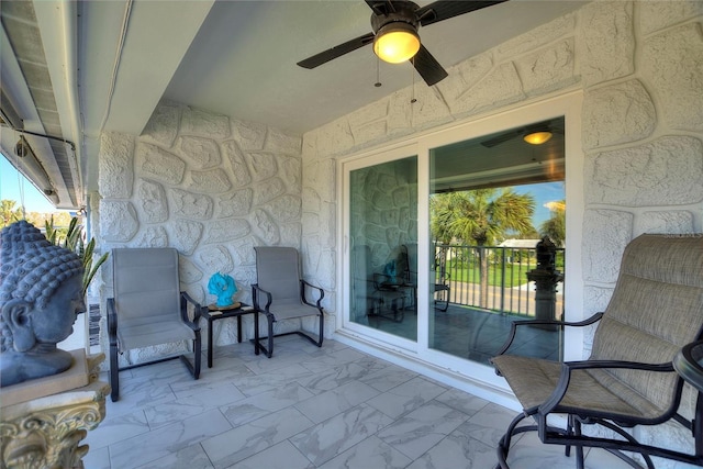 view of patio featuring ceiling fan