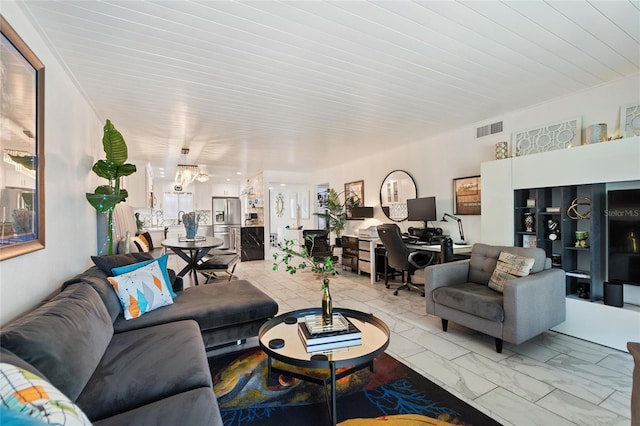 living room featuring marble finish floor and visible vents