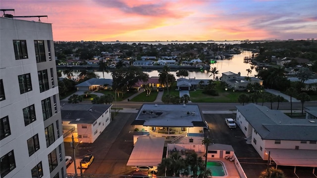 aerial view at dusk with a water view