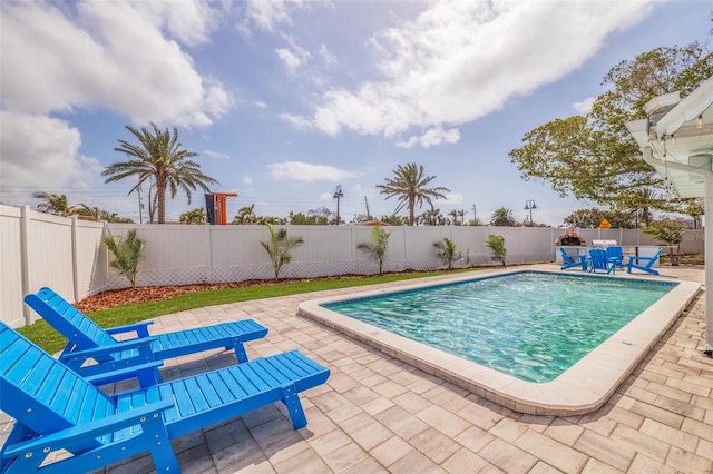 view of swimming pool featuring a fenced in pool, a patio, and a fenced backyard