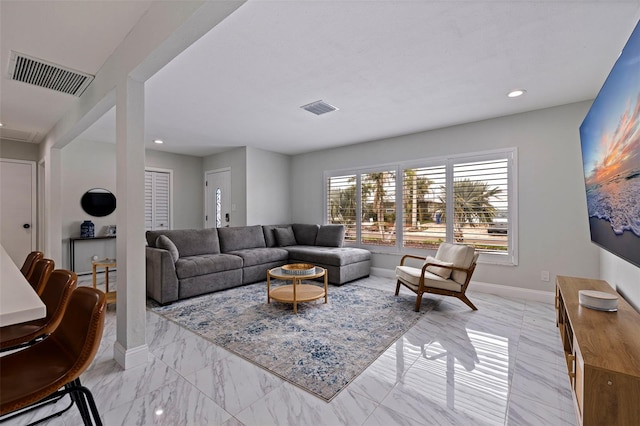 living area featuring recessed lighting, baseboards, and visible vents