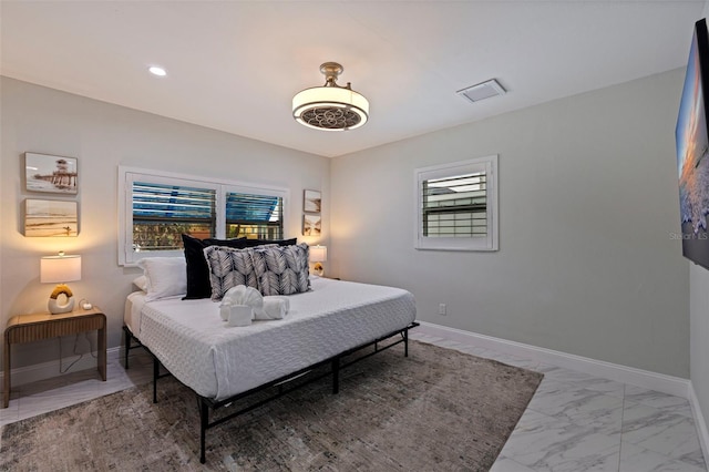 bedroom featuring recessed lighting, visible vents, marble finish floor, and baseboards