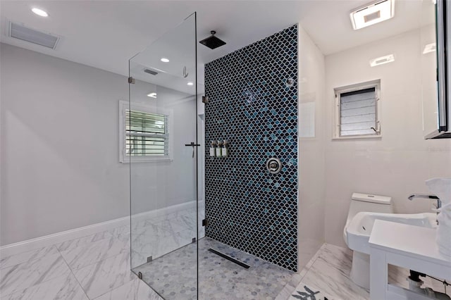 full bathroom with toilet, visible vents, marble finish floor, and tiled shower