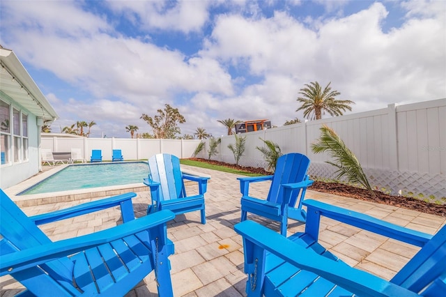 exterior space featuring a patio area, a pool, and a fenced backyard