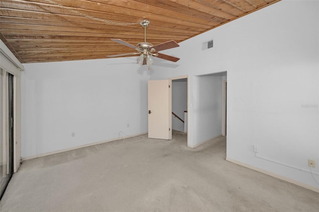 unfurnished bedroom featuring lofted ceiling, wooden ceiling, light colored carpet, visible vents, and baseboards