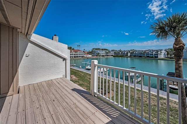 wooden deck with a water view