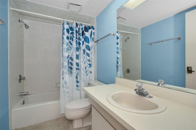 full bath with a textured ceiling, toilet, vanity, visible vents, and shower / tub combo with curtain