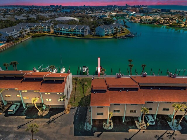 aerial view at dusk with a water view