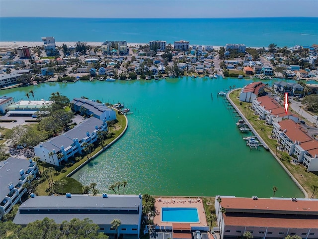 birds eye view of property with a water view