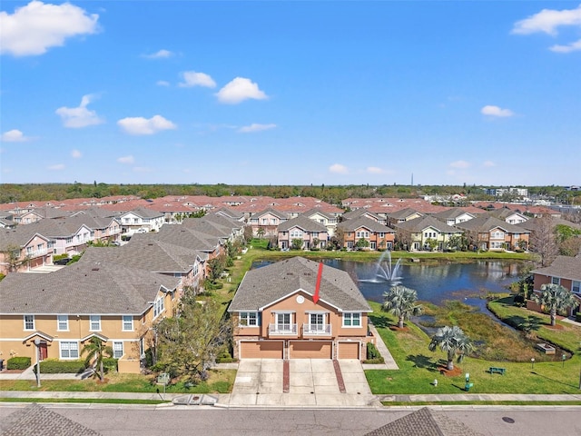 aerial view with a water view and a residential view