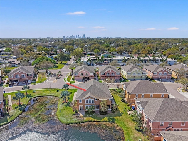 birds eye view of property featuring a residential view and a water view