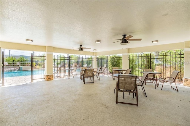 exterior space featuring ceiling fan