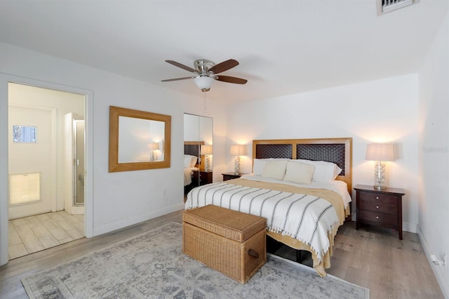 bedroom featuring light wood-type flooring, visible vents, ceiling fan, and baseboards