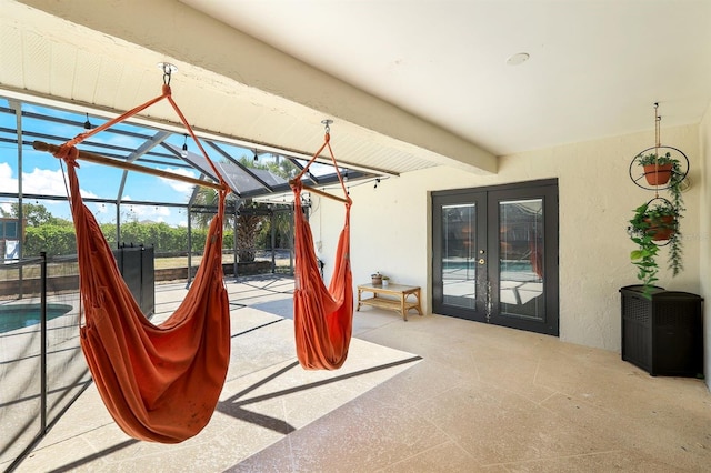 interior space with a lanai, an outdoor pool, a patio, and french doors