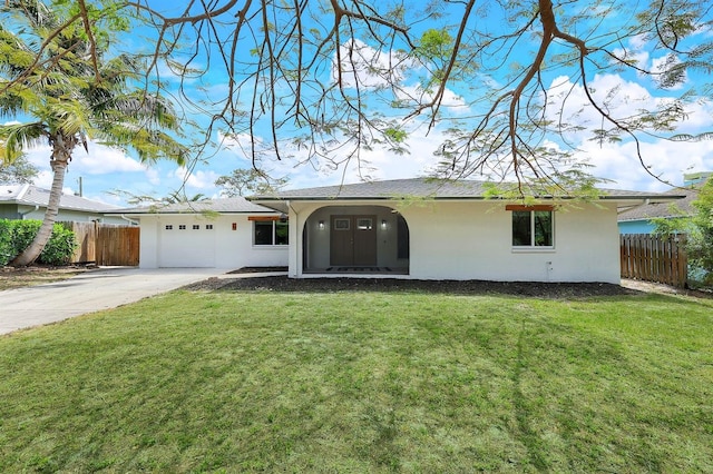 ranch-style house featuring driveway, a front lawn, fence, and stucco siding